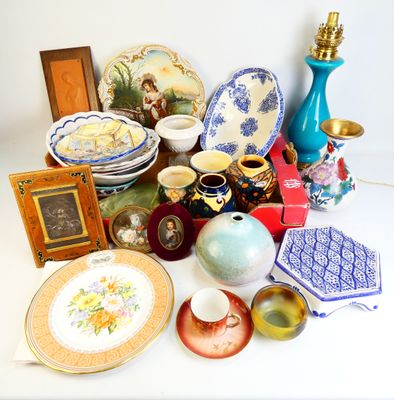 many different types of vases and plates on the table