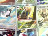 a lot of pokemon cards that are on the table