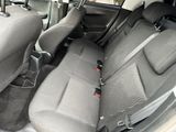 the back seats of a car with a seat belt in a car