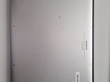 a picture of a silver laptop on a white table