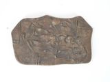 a metal plaque with a picture of a man riding a horse