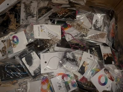 a box full of assorted jewelry and other items