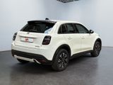 the rear end of a white fiat suv parked in a showroom