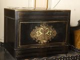 a black box sitting on top of a wooden table