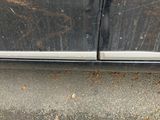 a close up of a car door with a broken glass