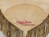 a picture of a heart shaped purse with fringes on it