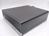 an image of a small black computer on a white surface