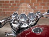 a close up of a motorcycle with gauges on it ' s handlebars
