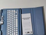 a blue case with a keyboard and a charger on it