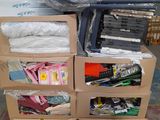 many boxes of clothes on a carton in a warehouse