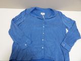 an image of a blue shirt sitting on top of a white table