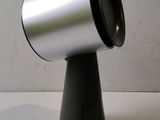 a silver and black object on a white table