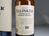a bottle of talisker 10 year old scotch whisky next to a bottle of talisker 10 year old scotch whisky