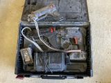 a tool box with tools on the floor next to a pair of shoes