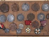 a wooden box with a lot of medals on it
