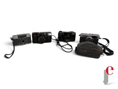 three cameras sitting next to each other on a white surface