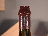 a bottle of wine that is sitting on a table