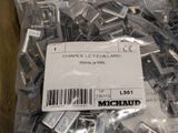 a bag of screws that are sitting on a table