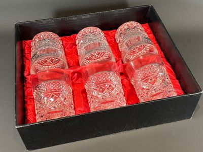 six glasses in a box with a red ribbon around them