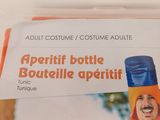 a bottle of wine in a plastic bag on a table