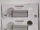 two boxes of baabania are stacked on top of each other on a table