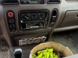 a box of bananas in the driver ' s seat of a car