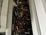 a lot of batteries in a drawer of a refrigerator