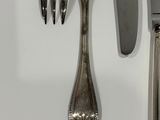 a knife, fork, and spoon on a table