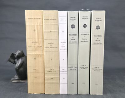 three books that are sitting next to each other on a table