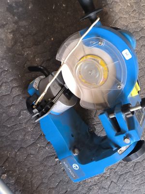 a blue machine that is sitting on the ground