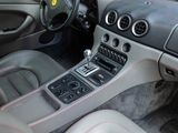 the interior of a car with a dashboard and a steering control