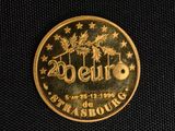 a close up of a gold coin with the words 20 cent on it