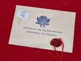 an old envelope with a wax seal and a wax stamp on it