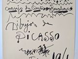 an old piece of paper with writing on it sitting on top of a table