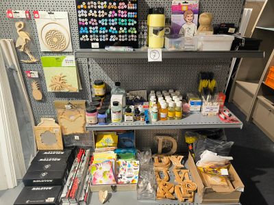 many items on the shelves in the craft room