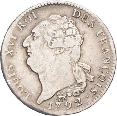 a close up of a coin with a woman ' s head on it