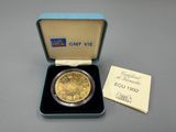 an image of a gold coin in a blue box with a card