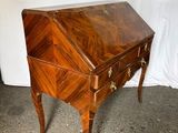 an old wooden desk with a drawer on top of it