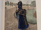 an open book with a picture of a woman in a blue dress