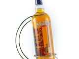an image of a bottle of alcohol sitting on top of a metal holder