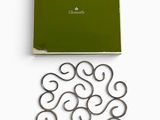 a green box with a bunch of metal rings on it