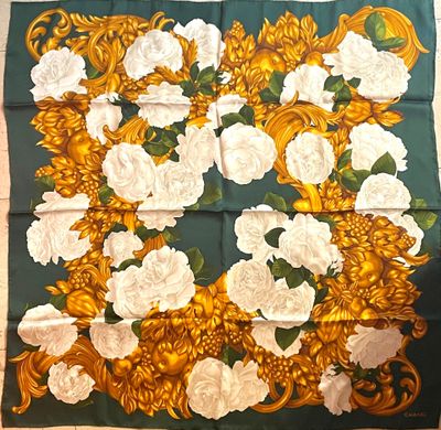 yellow and white roses and leaves on a green and gold scarf
