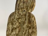 an image of a wooden statue of a woman with long hair