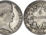 gros plan d'une pièce de monnaie sur laquelle figure un visage de femme