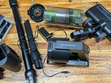many different types of vacuum cleaners on a wooden table