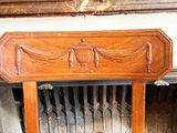 a chair that is sitting in front of a fire place