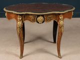 an image of a small table with a red and gold decoration