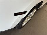 a sticker on the front of a white car