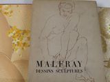 une image représentant un livre sur lequel figure le dessin d'une femme nue