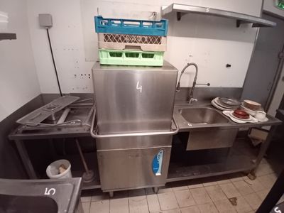 a kitchen with a sink and a stove in it